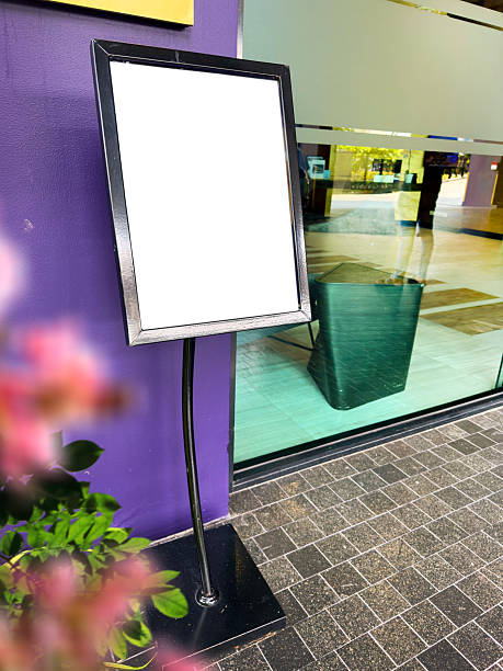 istock Blank outdoor advertising board by store window 2221405840