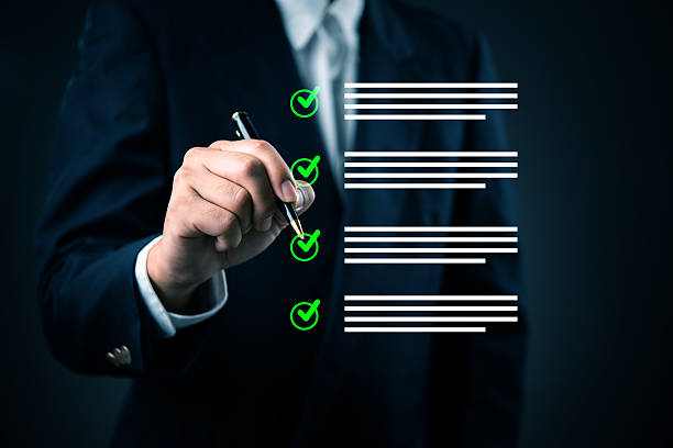 istock Man in suit completing virtual checklist, business success, goal accomplishment. Concepts task management, quality assurance, strategic planning, corporate responsibility, and reliable outcomes. 2221406089