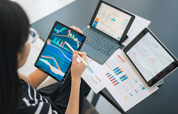 istock Close-up investing women focusing on working on machine learning AI lgorithms. the setting highlights flexibility in ai development, blending finacial tech and AI to easy invesment 2221411578