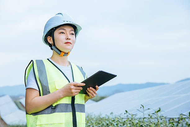istock Asian female engineer working with digital tablet in solar power station 2221413079