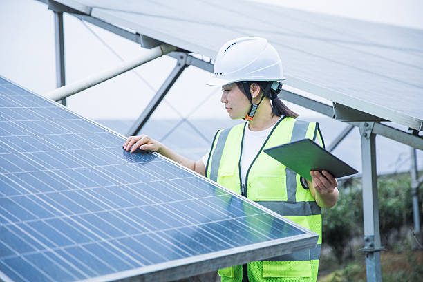 istock Green Energy. Female Engineer in Solar Power Plant. 2221413169