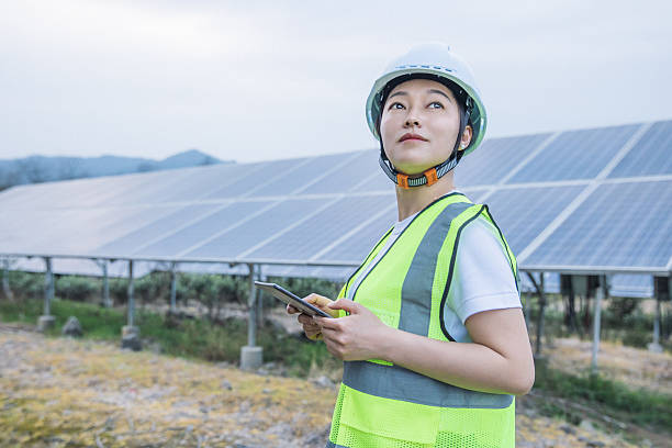 istock Woman engineer working in solar panel power plant 2221413240
