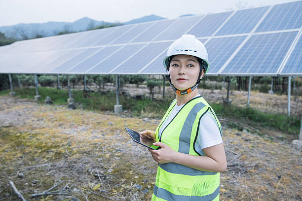 istock Woman engineer working in solar panel power plant 2221413242