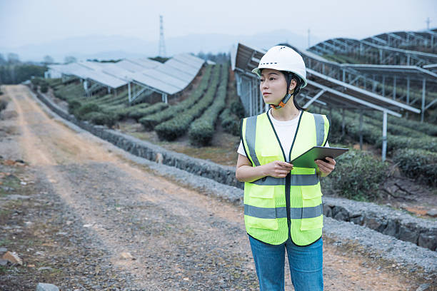 istock Asian female engineer working with digital tablet in solar power station 2221413570