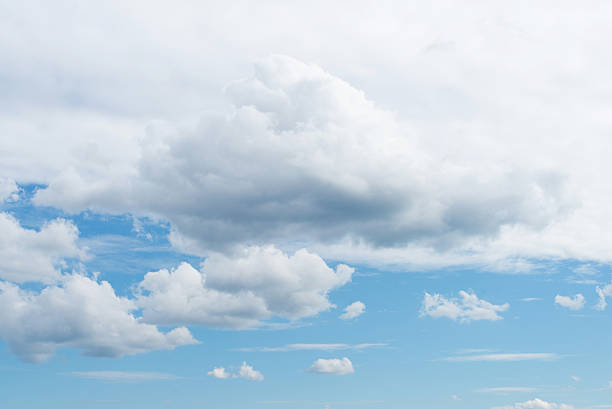 istock Half white and half blue sky with fluffy white clouds on a sunny day 2221414135