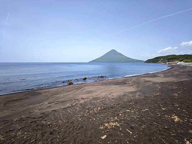 View at black sand beach and Kaimondake, a volcano which rises to a height of 924 metres near the city of Ibusuki in southern Kyūshū, Japan.
