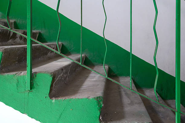 istock staircase with iron railings in a building under construction, close-up photo 2221428619