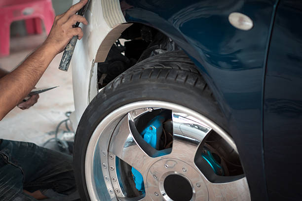 istock Checking car body work fiber bumper at car garage 2221429494