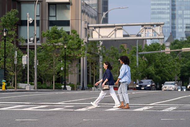 istock Two friends walking in the city 2221431935