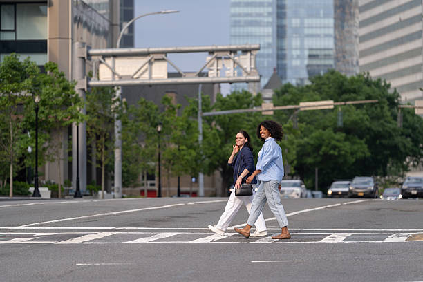 istock Two friends walking in the city 2221431937