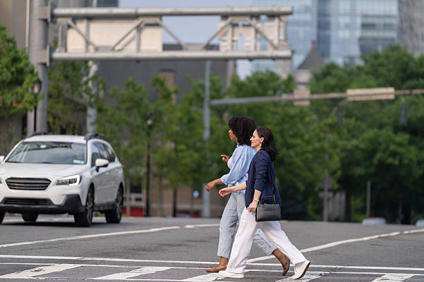istock Two friends walking in the city 2221431941