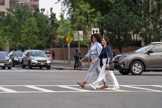 istock Two friends walking in the city 2221431949