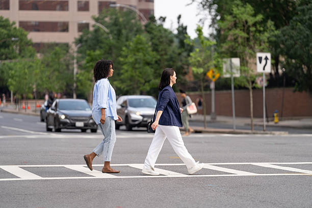 istock Two friends walking in the city 2221432997