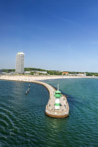 istock harbor entrance along the beach 2221436285