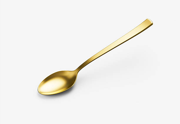 istock A shiny golden spoon with a reflective surface, slender handle and oval bowl. 3D Illustration. 2221438447