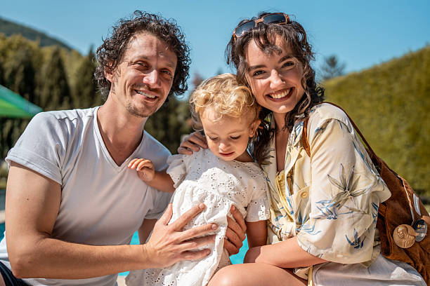 istock Happy Family Enjoying Quality Time Outdoors on a Sunny Day 2221441969