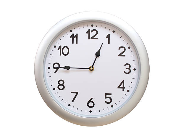 Simple wall clock with black frame and white face displaying 00:45 or 12:45. Ideal for time, schedule, and punctuality themes.