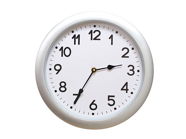 Round Silver Wall Clock Showing 02:35 or 14:35 Isolated-White. Useful for concepts like noon, midnight, deadline, countdown, or time management.
