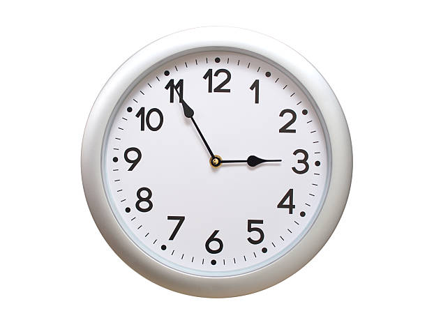 Round Silver Wall Clock Showing 02:55 or 14:55 Isolated-White. Useful for concepts like noon, midnight, deadline, countdown, or time management.