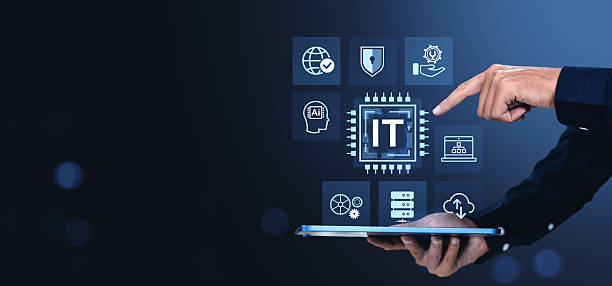 istock IT technology icons with hand interacting on digital tablet over dark blue background. 2221444355