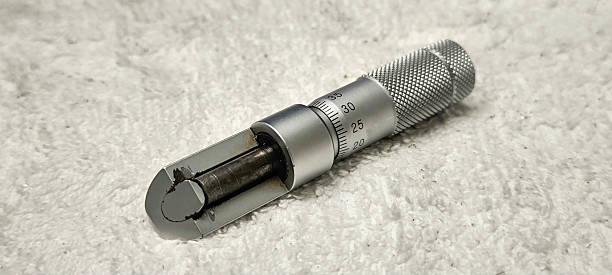 istock Micrometer for measuring thickness placed on a white towel 2221445016