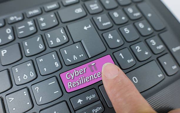 istock Cyber resilience key on a gray keyboard. Finger pressing key 2221446120