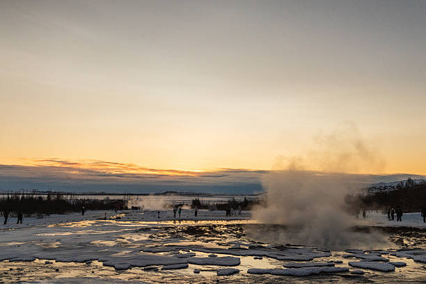 Geysir, Iceland - December 2024. Winter scene depicting an eruption of a Geyser at Geysir hot springs in the Golden circle in Iceland.