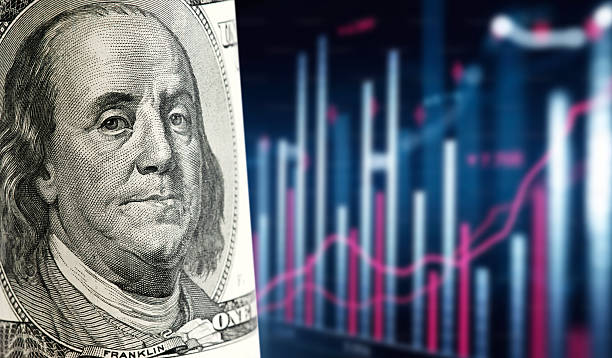 istock One hundred dollar bill with stock market graph showing growth 2221463820