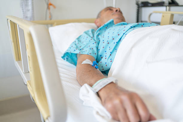 istock Senior Man In Hospital Bed 2221465254