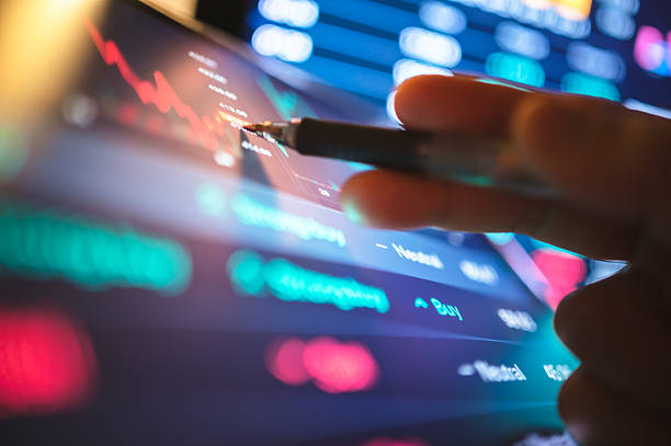 istock Businessperson tapping digital trading panel on glowing financial technology interface e for trading and financial data analysis in fintech environmentwith AI 2221466075