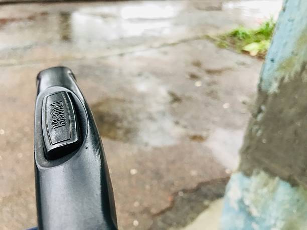 istock Travel suitcase handle showing push button mechanism 2221466333