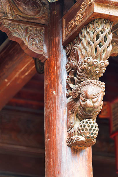 istock Exquisite Carved Lion Capital on Wooden Column 2221466559