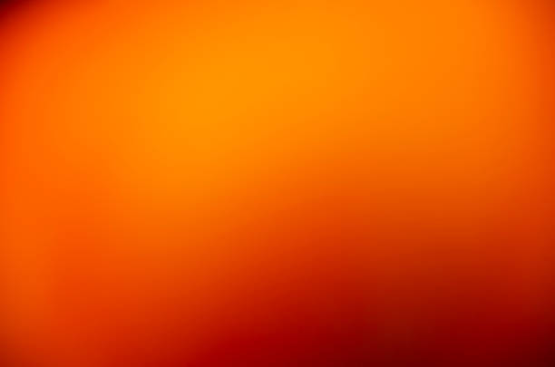 istock A warm orange gradient for a modern design. Pumpkin color. Summer or autumn background. An orange template with space to copy. 2221466565