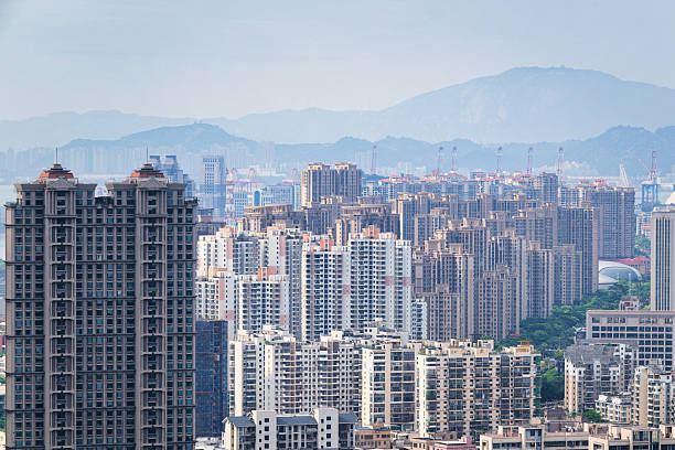 istock Towering Urban Buildings with Distant Mountains in Sight 2221466650