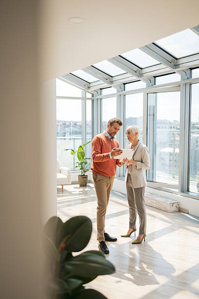 istock Colleagues collaborating in a bright modern office with natural light 2221467468