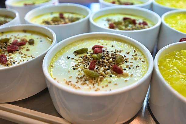 Delicious Dessert: Creamy Pudding Topped with Nuts and Dried Fruits