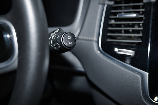 Close-up of Control Buttons on a Car Steering Wheel