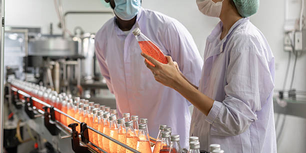 istock quality supervisor or food or beverages technician inspection about condition control food or beverages before send product to the customer. Production leader recheck machine and productivity. 2221486526