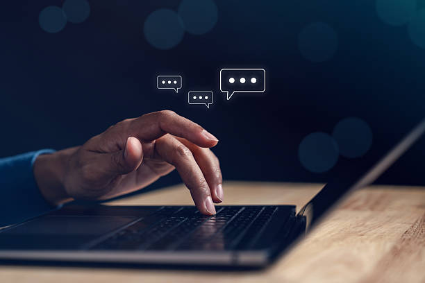 istock Typing on laptop keyboard with online chat representing chatbot communication 2221494038