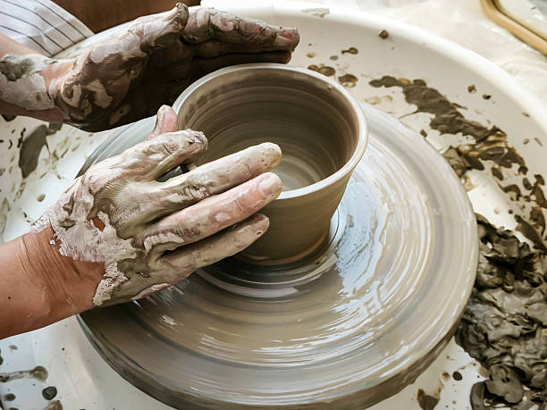istock The Texture and Shaping of Clay: Hands-Focused. 2221495928