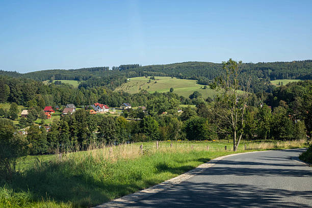 This captivating stock photo features a stunning, winding road stretching endlessly toward the horizon, symbolizing adventure, freedom, and new beginnings. The smooth asphalt cuts through breathtaking scenery, bathed in perfect natural light, creating a powerful visual metaphor for exploration and progress. Perfect for: Travel tourism campaigns Automotive advertising Motivational inspirational content Corporate presentations on growth and innovation Book covers and editorial designs