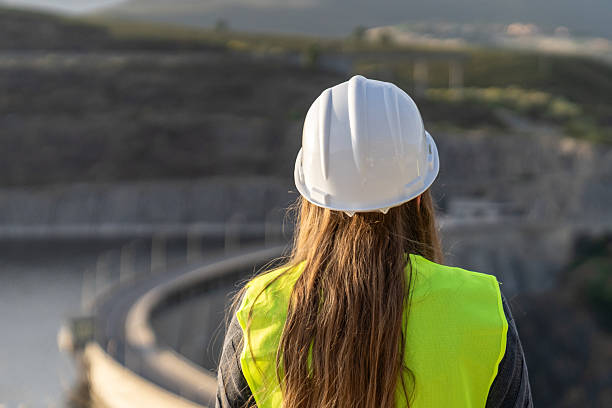 istock Female engineer overseeing construction of a dam project 2221507479