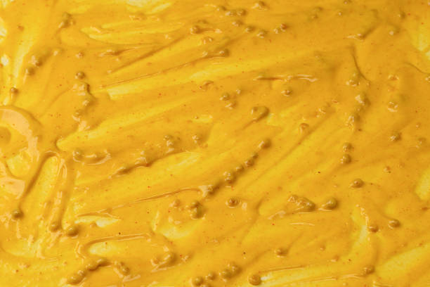istock Yellow sauce splashes as a background. 2221507906