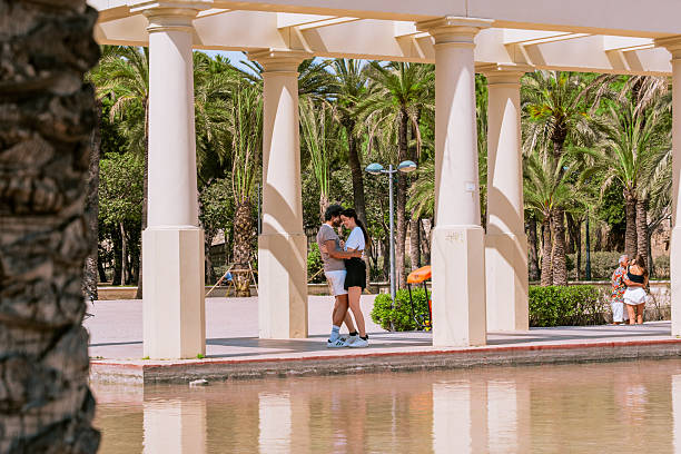 A shot of an affectionate young couple bonding together outdoors