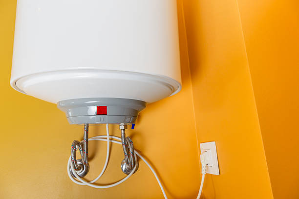 istock Electric boiler plugged into wall 2221510375