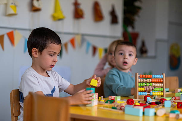 istock children are playing with blocks in kindergarten 2221511271