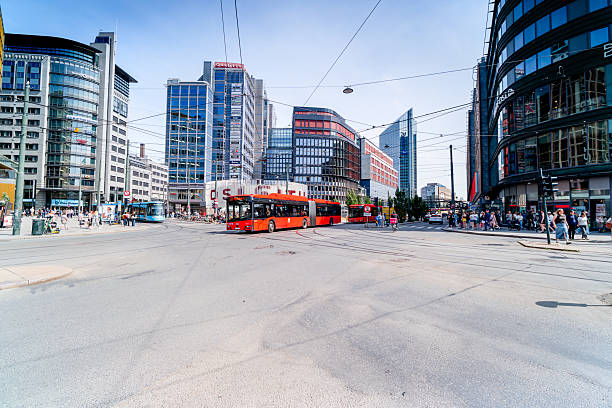 Public transport at an intersection in Oslo, Norway. Tam intersection in modern district. Life on a Scandinavian street.