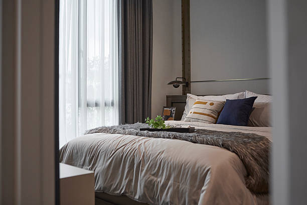 istock classic modern bedroom in hotel with sheer curtain 2221520483