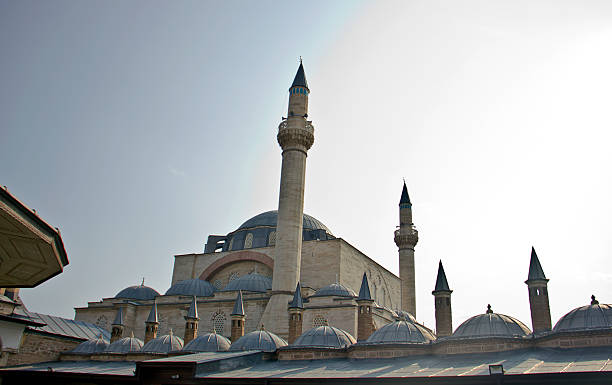 Konya, Turkey - May 19, 2025: Selimiye Mosque in Konya with Mevlana museum on the side. Konya is a pilgrimage destination for Sufis, a major city of the Anatolian Plateau, once capital of the Seljuk Sultanate and still famous today for the whirling dervishes. Here in particular the Mevlana Museum.