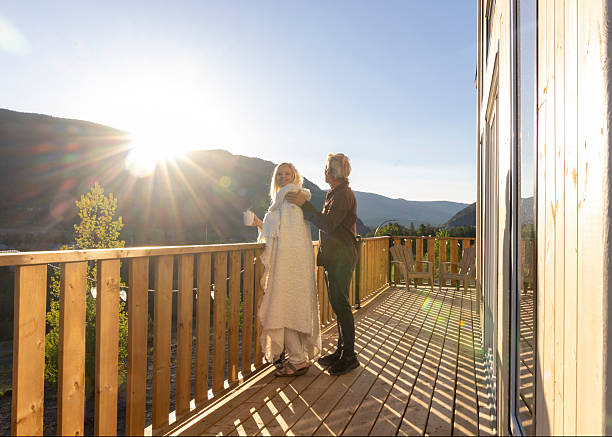 istock Mature couple enjoy hot beverage on deck at sunrise 2221521302